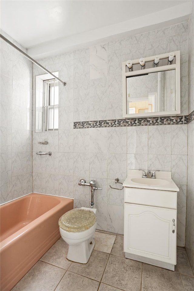 bathroom featuring tile walls, shower / bath combination, vanity, and toilet