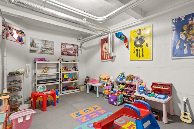 game room with concrete flooring