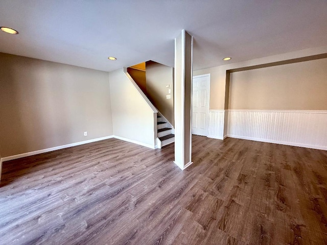 basement featuring stairway, wood finished floors, and recessed lighting