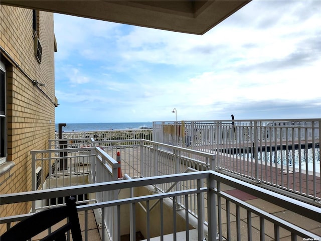 balcony featuring a water view