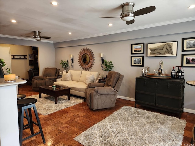 living area featuring a ceiling fan, recessed lighting, ornamental molding, and baseboards