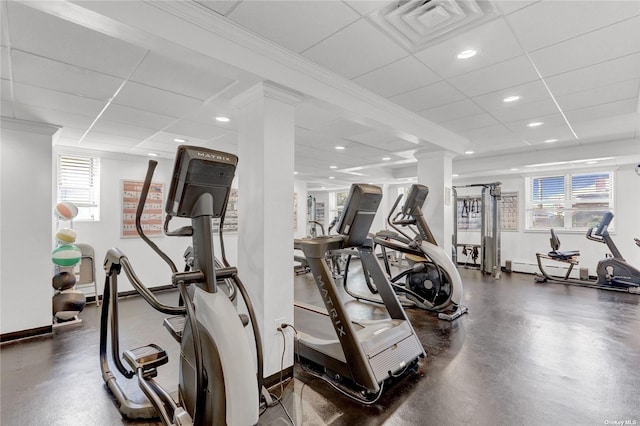 gym with a drop ceiling, recessed lighting, visible vents, baseboards, and ornate columns