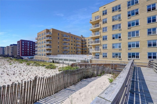 view of property's community featuring fence