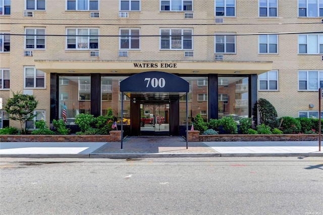 property entrance with brick siding
