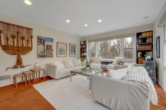 living room featuring recessed lighting, light colored carpet, and visible vents