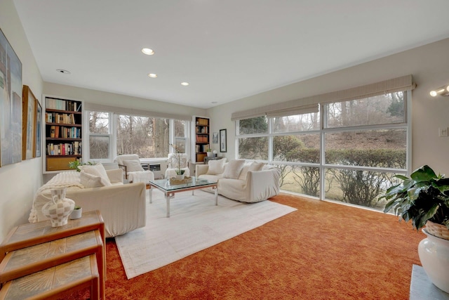 living room with a wealth of natural light, carpet flooring, and recessed lighting