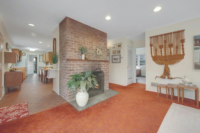 carpeted living room with tile patterned floors, a fireplace, visible vents, and recessed lighting