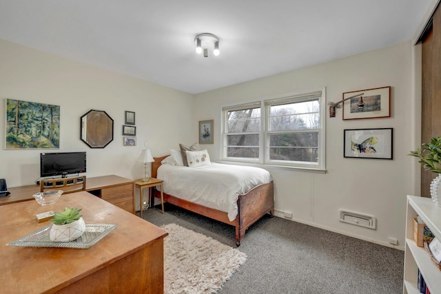 bedroom with carpet and baseboards