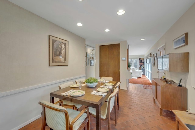 dining room featuring recessed lighting