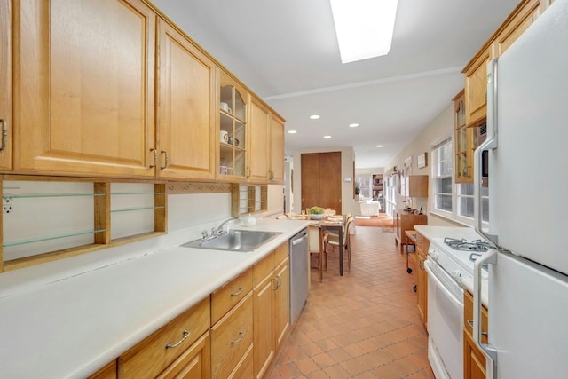 kitchen with recessed lighting, white appliances, a sink, light countertops, and glass insert cabinets