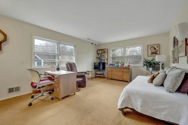 bedroom featuring light colored carpet, visible vents, and baseboards