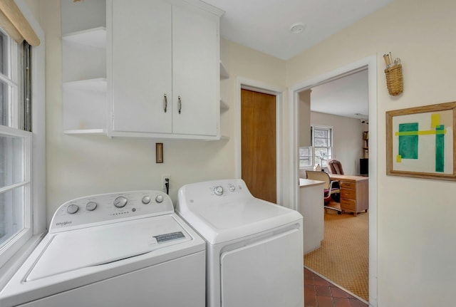 laundry area with cabinet space and independent washer and dryer