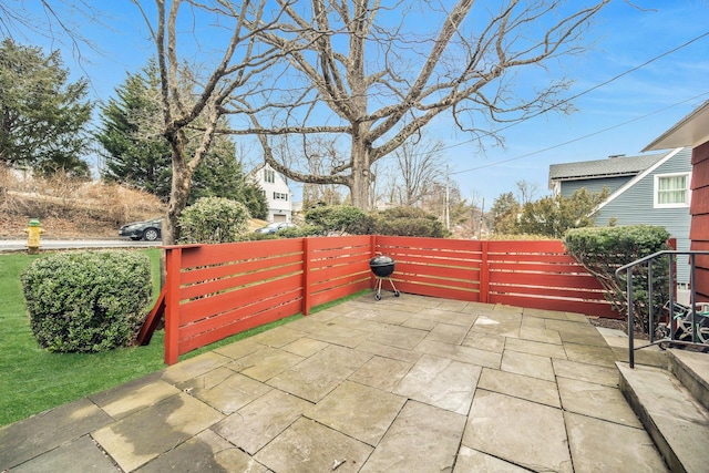 view of patio featuring fence