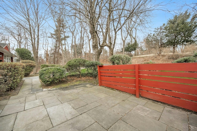 view of gate with a patio area and fence