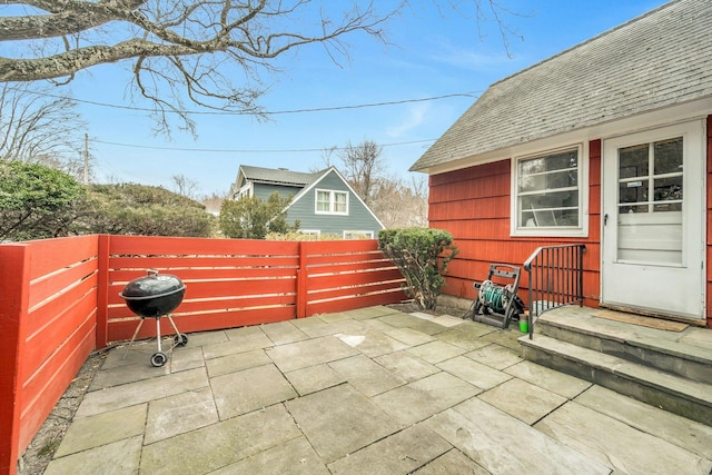 view of patio / terrace featuring fence and grilling area