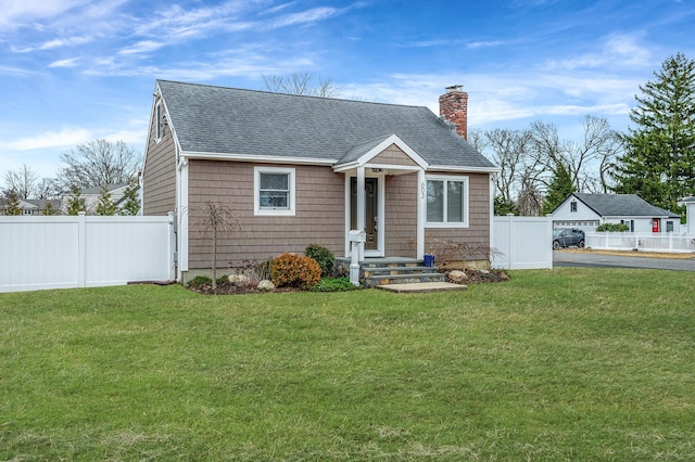 bungalow-style home featuring roof with shingles, a chimney, fence, and a front yard