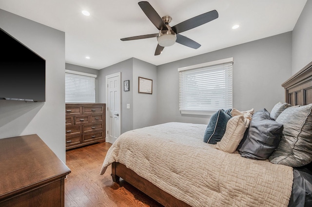 bedroom featuring recessed lighting, ceiling fan, and wood finished floors