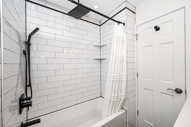 bathroom with shower / bath combo with shower curtain