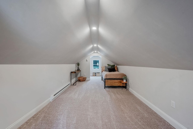 additional living space with vaulted ceiling, carpet, a baseboard radiator, and baseboards