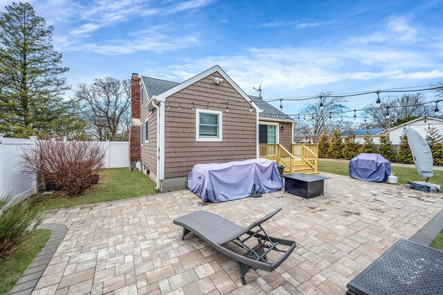 view of patio with a fenced backyard and grilling area