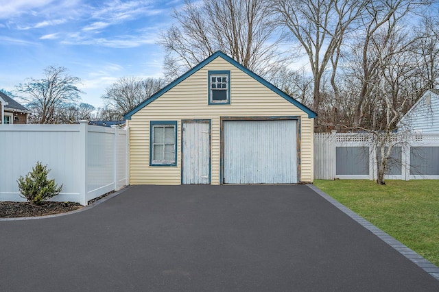 detached garage with fence