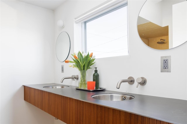 interior space with double vanity and a sink