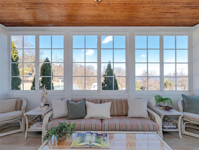 sunroom / solarium featuring wooden ceiling and a wealth of natural light