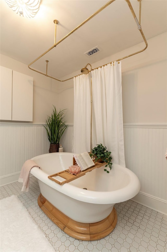 71 Old Mountain Rd S, Nyack, NY 10960 - full bath featuring a wainscoted wall, a freestanding bath, and baseboards