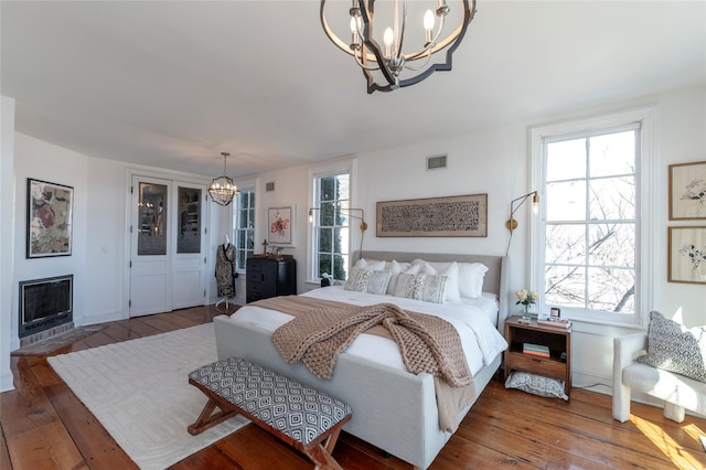 71 Old Mountain Rd S, Nyack, NY 10960 - bedroom featuring a chandelier, hardwood / wood-style flooring, and multiple windows