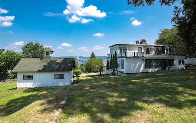 71 Old Mountain Rd S, Nyack, NY 10960 - rear view of property featuring a balcony, a yard, a chimney, and an outbuilding