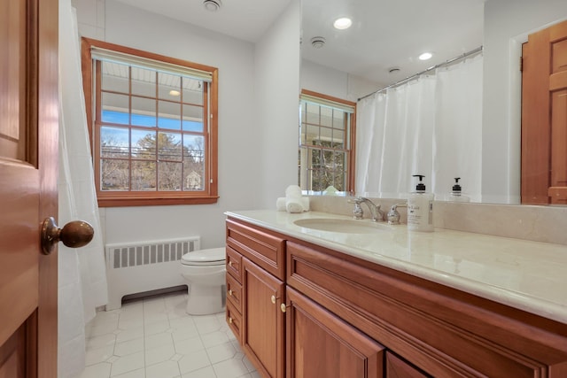 full bath with recessed lighting, toilet, radiator heating unit, vanity, and tile patterned flooring