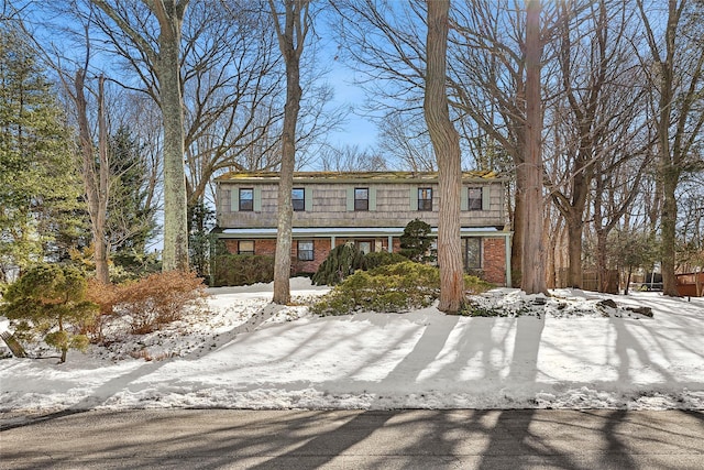 view of property with brick siding