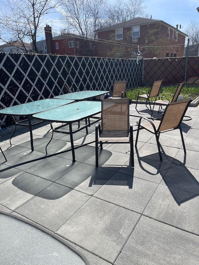 view of patio / terrace featuring fence