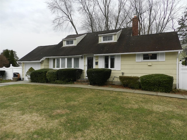 cape cod home featuring a chimney, concrete driveway, a front yard, fence, and a garage