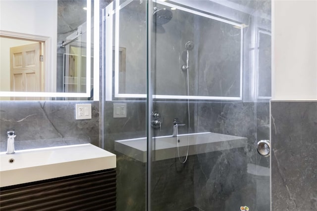 full bathroom featuring backsplash, a shower stall, and vanity