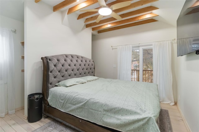 bedroom with light wood-style floors, beamed ceiling, and baseboards