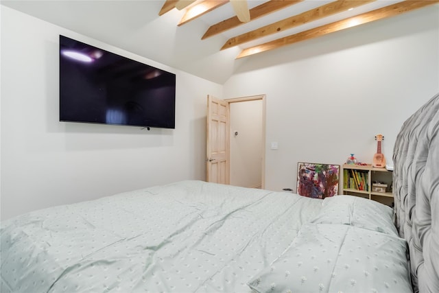 bedroom with lofted ceiling with beams