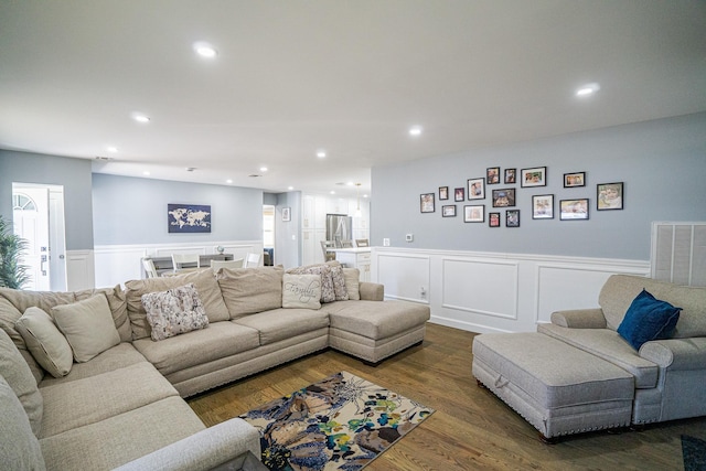 living room featuring wainscoting, dark wood finished floors, visible vents, and recessed lighting