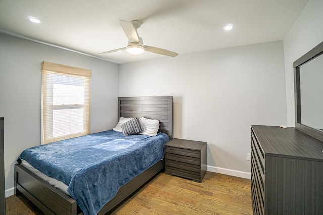 bedroom featuring baseboards, ceiling fan, recessed lighting, and light wood-style floors