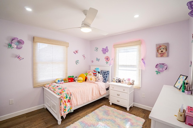 bedroom with dark wood-style flooring, ceiling fan, and baseboards