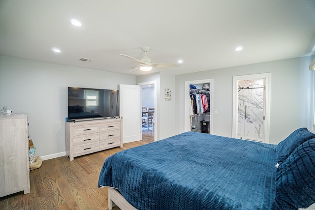 bedroom with ceiling fan, recessed lighting, wood finished floors, visible vents, and baseboards