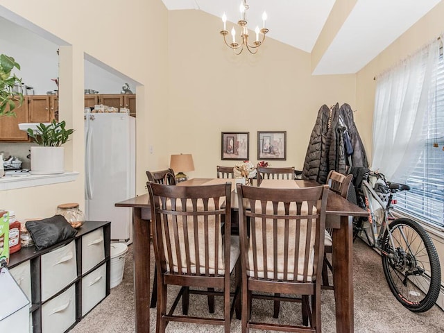 carpeted dining room featuring vaulted ceiling and an inviting chandelier