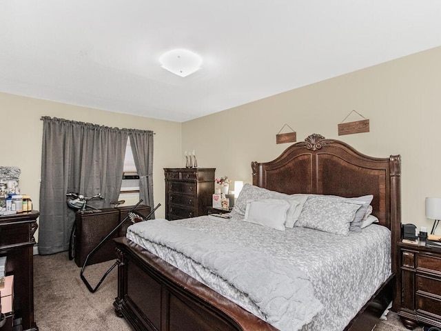 bedroom featuring light carpet