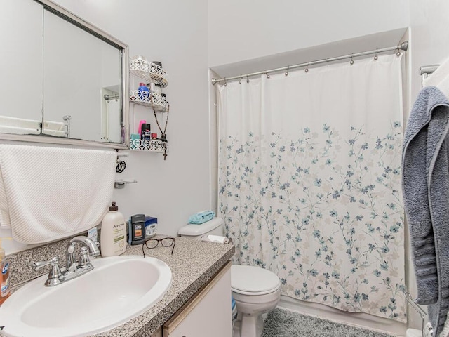 full bathroom with a shower with curtain, vanity, and toilet