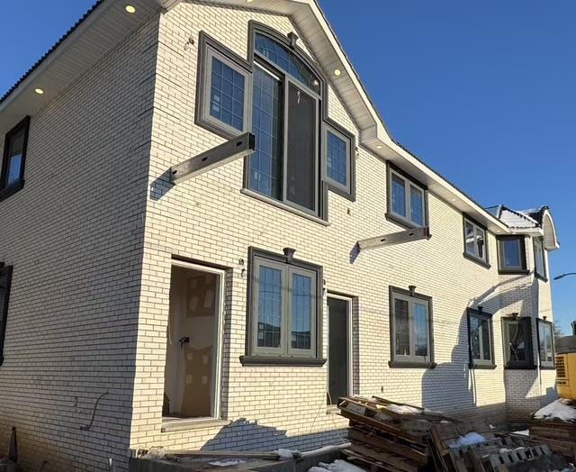 view of front of home with brick siding