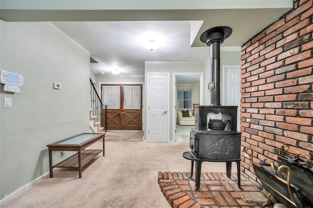 interior space featuring light carpet, stairway, and baseboards