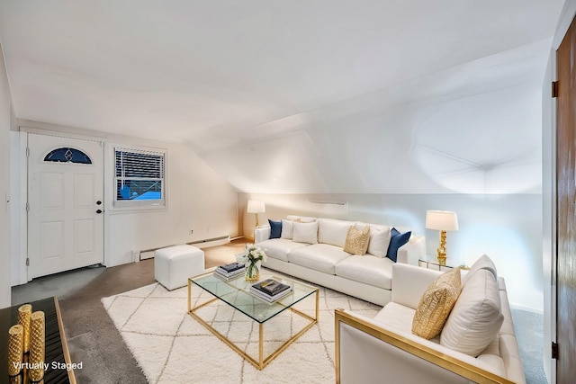 living area with lofted ceiling and a baseboard heating unit