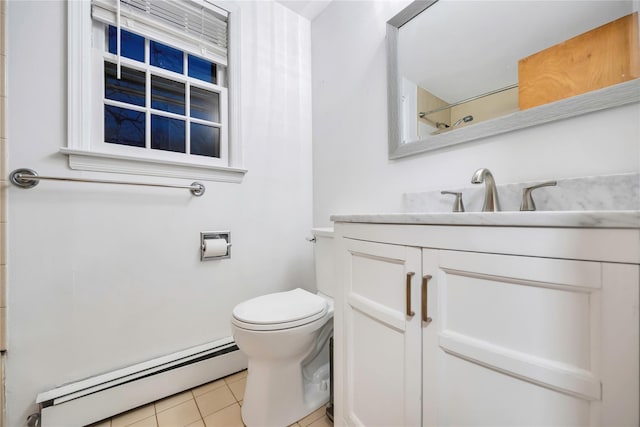 bathroom featuring toilet, a baseboard radiator, tile patterned flooring, and vanity