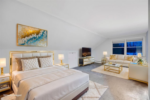 bedroom with carpet, a baseboard heating unit, and vaulted ceiling