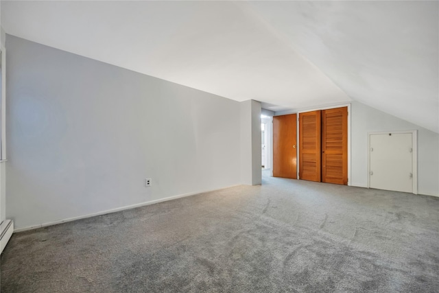 bonus room featuring lofted ceiling, carpet flooring, and baseboard heating